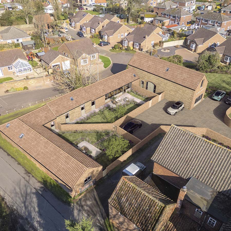 aerial drone shot of barn conversion in Lincolnshire with CGI of refurbished scheme overlaid