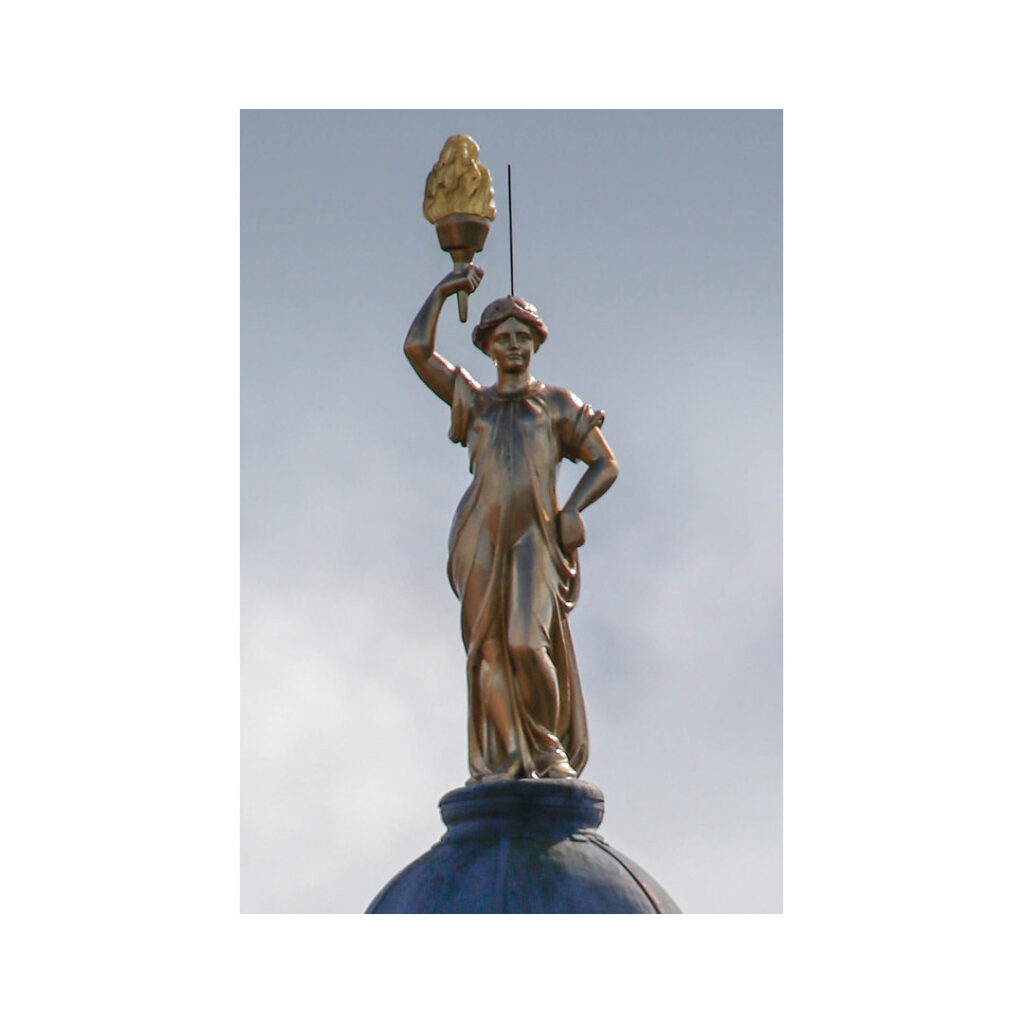 photograph of Aurora statues sitting on Kings Theatre dome in Portsmouth